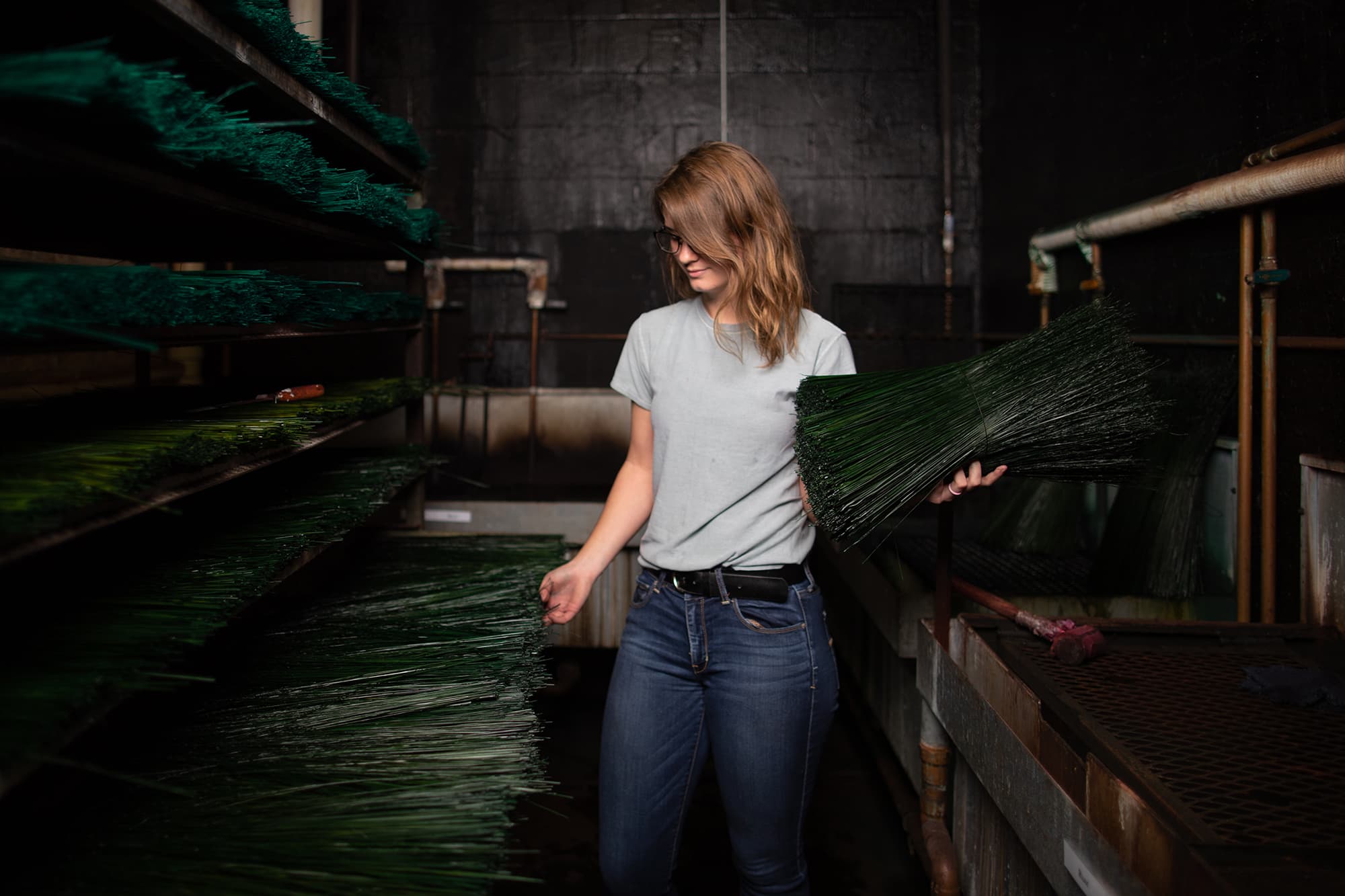 Student selecting broom corn in Student Craft