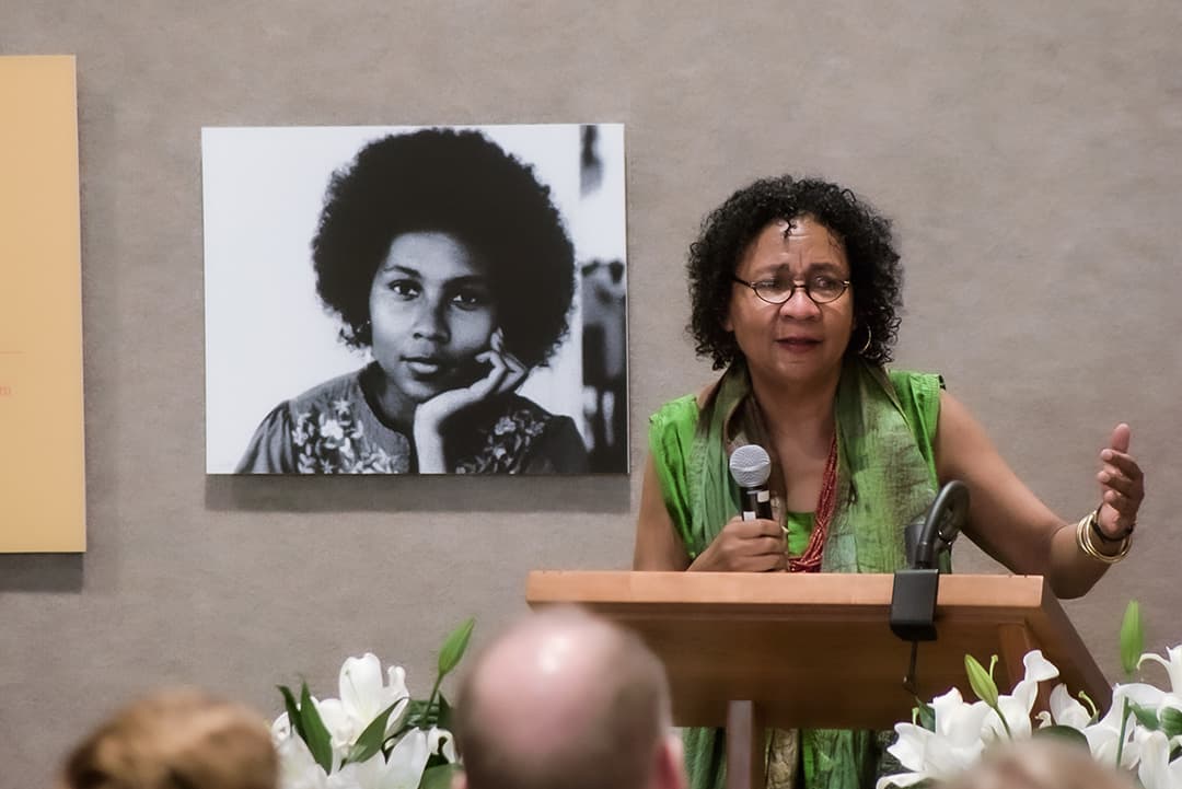 Photo of bell hooks presenting papers to Berea College in 2015