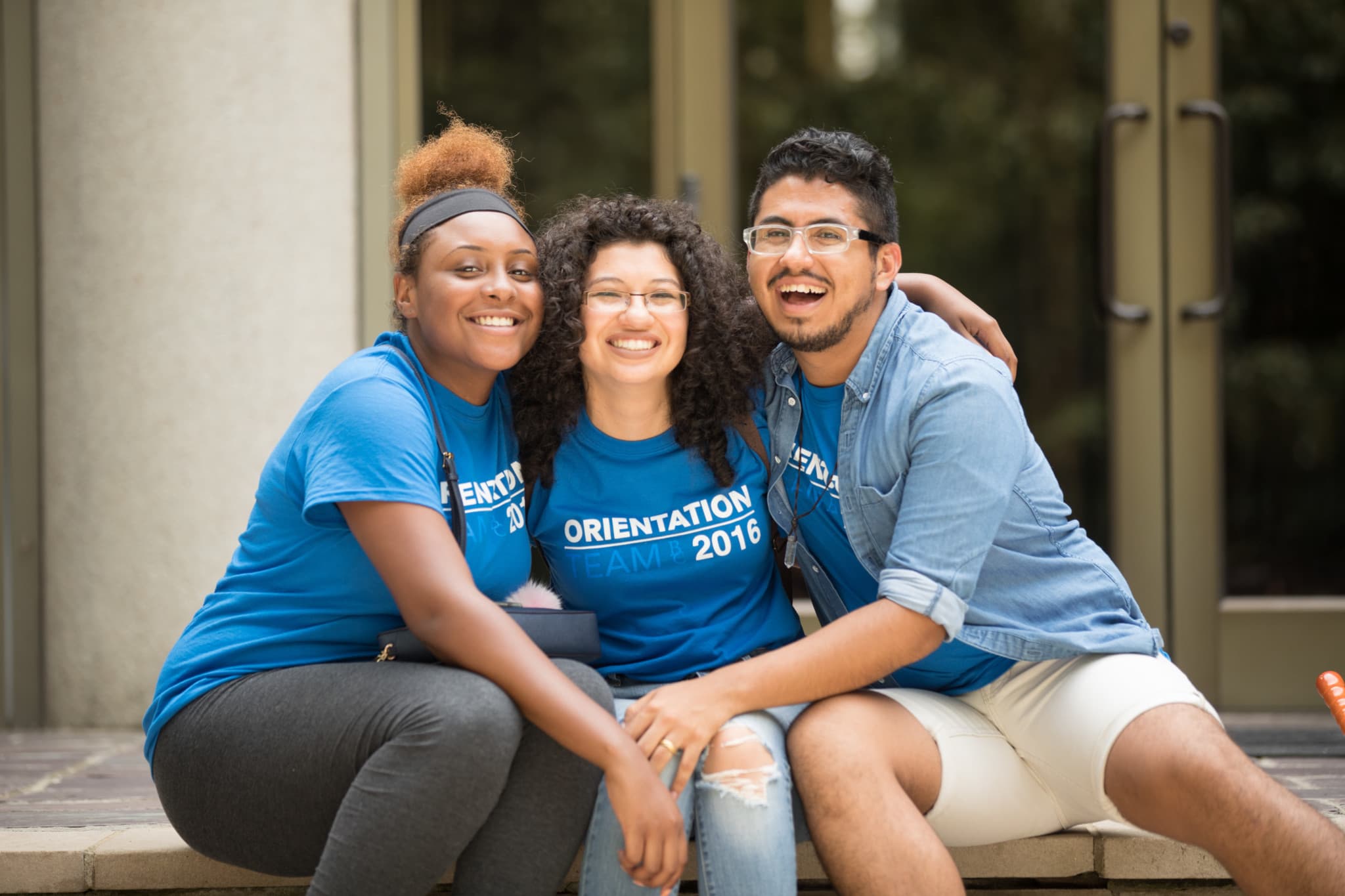 Three students hug at Berea College