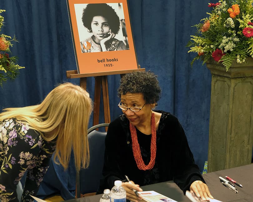 bell hooks signs books following her induction into the Kentucky Writers Hall of Fame in 2018. Photo by Tom Eblen/Lexington Herald-Leader