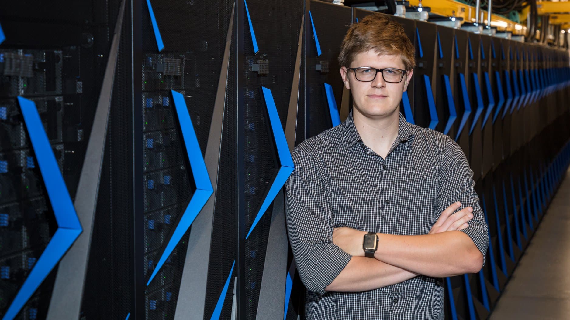 Eli Prater in front of supercomputer Titan