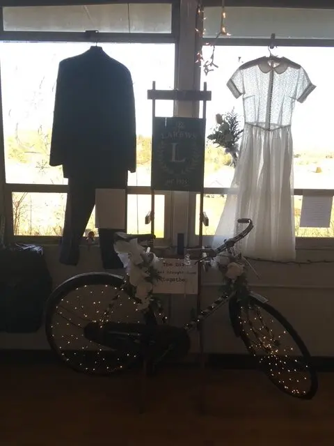 The bike that brought them together at their 60th wedding anniversary, displayed next to their wedding attire.